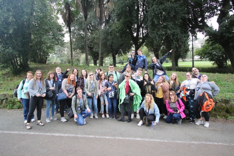 group of people all smiling and posing together